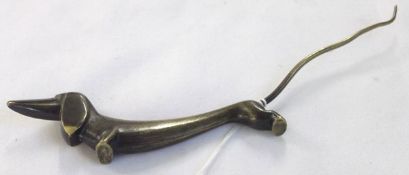 A small Austrian Bronze Model of a Dachshund, marked for retailer Rena Rosenthal, 7 ½” long