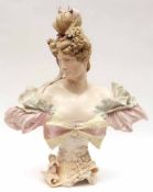 An Ernst Wahliss Austrian Model of a young female bust decorated throughout in colours, raised on