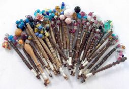 A bag containing a large quantity of assorted Treen Lace Bobbins, each with glass spangles