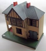 A mid-20th Century Tri-ang Tudor Style Dolls House, with central front opening section to reveal