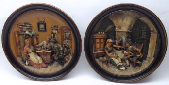 Two German Relief Moulded Wall Plaques, by Musterschutz, both modelled with interior tavern