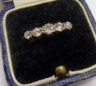 An 18ct Gold and Platinum five old cut Diamond Engagement Ring, the centre stone of approx .2 ct