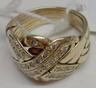 An interesting eight section Russian style “puzzle” Ring, set with bands of small brilliant cut