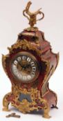 An early 20th Century French Boulle style Mantel Clock, unsigned, the waisted case decorated on