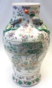 A Japanese large baluster Vase, the neck moulded with dragons and the body painted predominantly