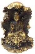 A 20th Century Tibetan or Indian gilt metal Figure of a seated Deity in the Lotus position, seated