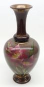 A Doulton floral decorated baluster Vase, decorated in pink and green on a light brown background,