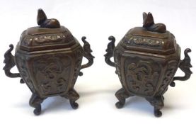 A pair of late 19th Century Chinese Bronze covered small Vases of two handled canted rectangular