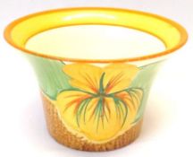 A Clarice Cliff circular Sugar Bowl of tapering from, decorated with the “Nasturtium” pattern, on