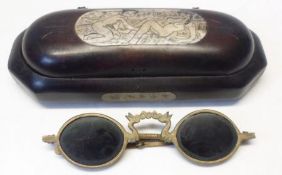 A pair of gilt metal framed Chinese Sunglasses in a lacquered case, the lid inset with an erotic