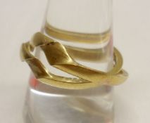 An interesting unmarked Gold “Love” Ring of two parts fitting together to conceal the following