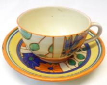 A Clarice Cliff Tea Cup & Saucer, decorated with the “Umbrellas and Rain” pattern, Bizarre and