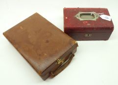 A small brown Leather Carry Case fitted with Brass catch together with a red Leather covered,