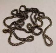 A long length of unmarked white metal flattened Curb Link Watch Chain, approximately 62” long,