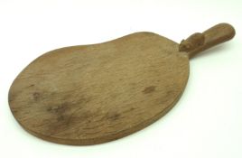 A Mouseman Oak Cheeseboard, the handle carved with a small mouse, overall signs of use/