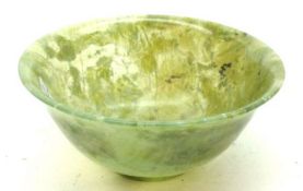 A circular Bowl of tapering form, with slightly everted rim, possibly spinach Jade or Jadeite,