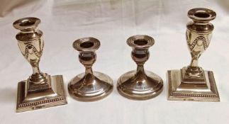 A pair of Edwardian Dressing Table Candlesticks on beaded and sloped square bases, the vase shaped