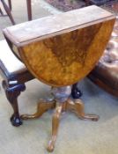 A small Victorian Burr Walnut veneered drop leaf Table, raised on quatra base, to a turned column,