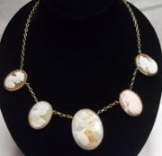 A group of five graduated Shell cameo Plaques mounted on a modern yellow metal chain.