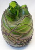 An early 20th Century Studio Glass Vase, overlaid with a tube lined geometric design and unusually