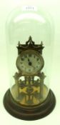 An early 20th Century Brass revolving pendulum Mantel Clock, with circular face with Arabic