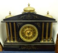 A large Victorian black Marble Mantel Clock of colonnade form, Ansonia striking on a gong
