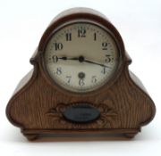 An early 20th Century Oak cased Mantel Clock with circular black Arabic chapter ring, 7” high