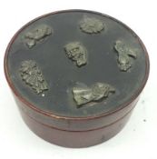 An unusual Oriental lacquered Round Box, the top with five small abstract metal panels, 4” diam.