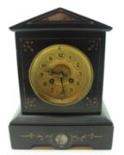 A Victorian black Marble Mantel Clock with arched top, circular gilded face with black Arabic