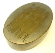 An Oriental mixed metals oval Snuff Box, with hieroglyphics to the lid, slate and copper lined