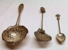 A Mixed Lot comprising: Far Eastern white metal Tea Strainer with applied dragon design to the