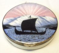 A Norwegian white metal circular Compact, the lid enamelled with a Viking Ship at Sunset, gilt lined