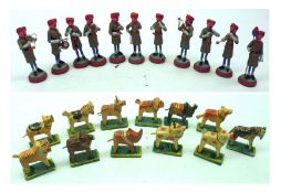 A set of twelve miniature Eastern painted Models of a Military Band; together with a box of twelve