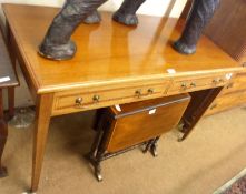 An Edwardian Mahogany two drawer rectangular Side Table, raised on tapering legs to Brass castors,
