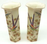 A pair of Crown Ducal six sided Vases, decorated with humming birds amongst foliage, 8 ½” high