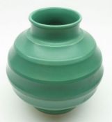 A Wedgwood Keith Murray squat round Vase of ribbed form, decorated in plain turquoise, 7 ½” high.