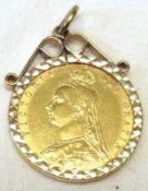 A Victorian Gold Half Sovereign dated 1892 within a hallmarked 9ct Gold Diamond engraved Pendant