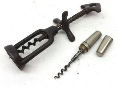 A Vintage Iron Corkscrew with central wing nut; together with a small portable Pocket Corkscrew, the
