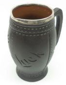 A Doulton Silicon Ware Black Jack type Jug with Silver rim, 7” high.