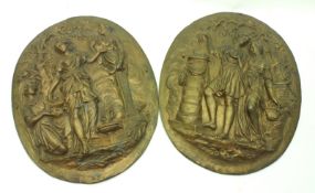 A pair of heavy oval gilt metal plaques embossed with Greco Roman Figures, Foliage, etc, each 13”