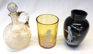 A small Amber Glass Beaker, a further black Glass baluster Vase and a small ovoid Decanter (repair