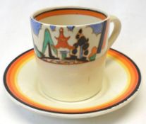 A Clarice Cliff Can shaped Cup and Saucer, decorated with a cartouche pattern of the “Kew” design.