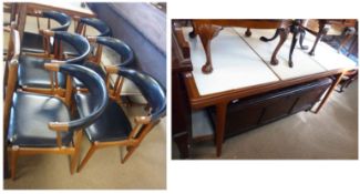 A Danish Teak Extending Dining Table together with a set of six matching black Vinyl upholstered