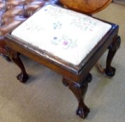 An early 19th Century Walnut rectangular Stool, raised on four heavy cabriole legs with shell knees,