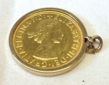 An Elizabeth II Gold Sovereign within a hallmarked 9ct Gold Plain Pendant Mount.