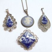 A pair of Dutch filigree white metal frame and tear drop ceramic panelled Pendants depicting