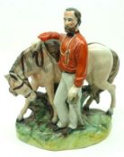 A Staffordshire Figure Group of Garibaldi and Horse, raised on a plinth base, 9” high.