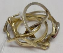 An interesting Russian style six section “puzzle” Ring, set with two bands feature in total thirteen