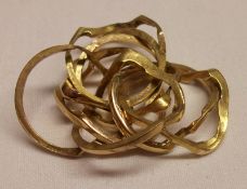 An unmarked precious metal multi-banded “puzzle” Ring, weighing approximately 18g.