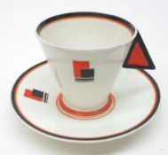 A Shelley Vogue Cup and Saucer, decorated in orange and black, registration number RD756533, 3 ½”